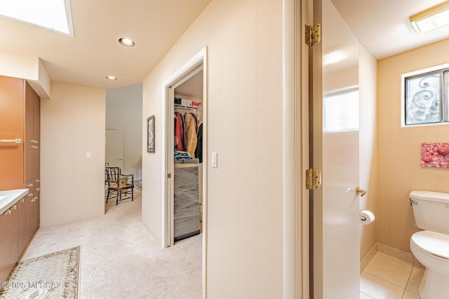 bathroom with toilet and recessed lighting