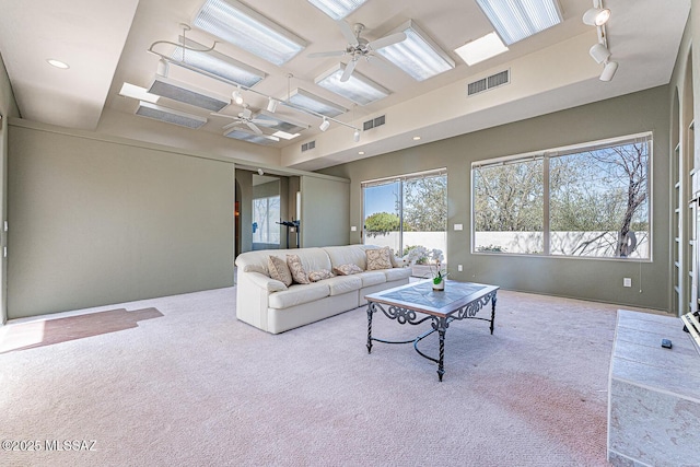 carpeted living room featuring recessed lighting, track lighting, visible vents, and ceiling fan
