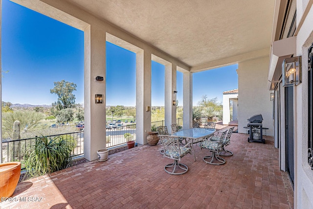 view of patio / terrace featuring outdoor dining area and a grill