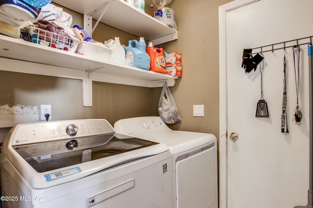 washroom featuring separate washer and dryer and laundry area
