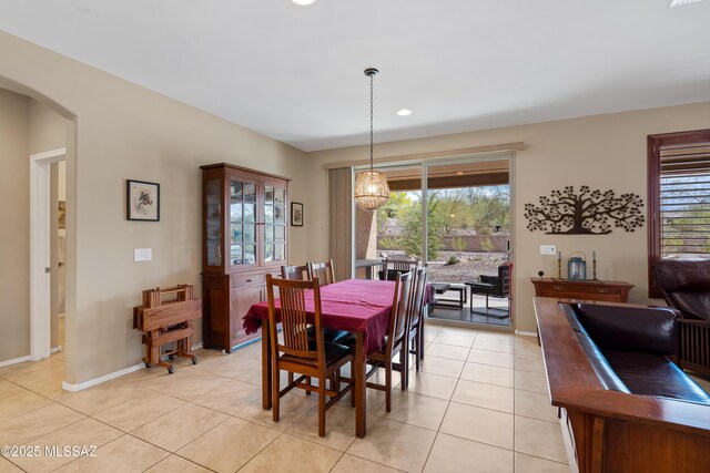 14082 N Tiyo Point Trl, Marana, AZ 85658 - dining room with a healthy amount of sunlight, light tile patterned floors, and baseboards