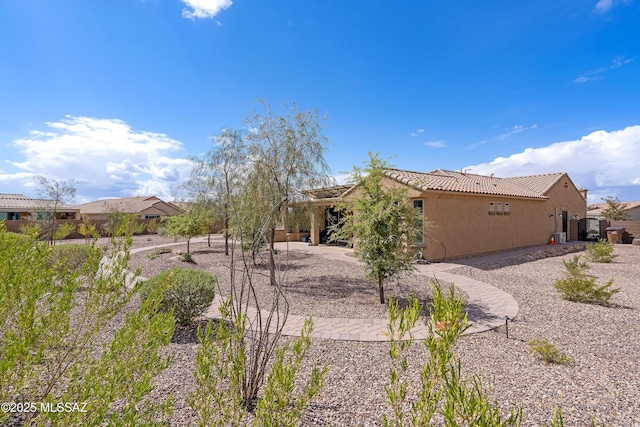 14082 N Tiyo Point Trl, Marana, AZ 85658 - exterior space with a patio, a tiled roof, and stucco siding