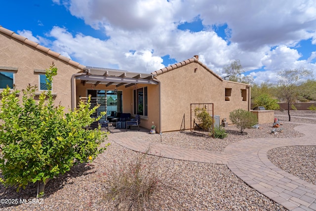 14082 N Tiyo Point Trl, Marana, AZ 85658 - back of property featuring a patio area, a tile roof, and stucco siding