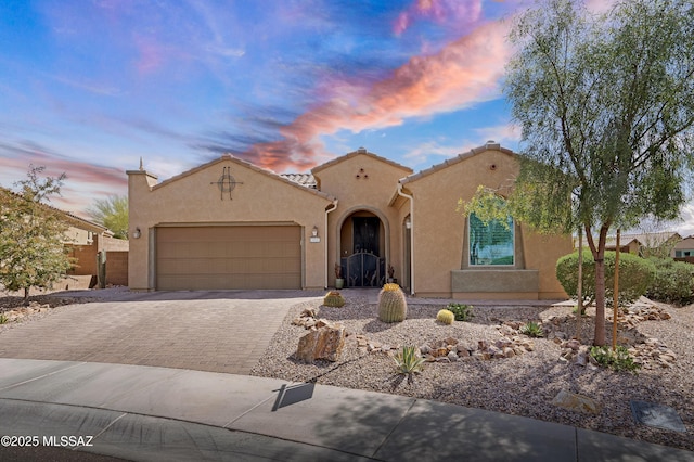 14082 N Tiyo Point Trl, Marana, AZ 85658 - mediterranean / spanish home with driveway, stucco siding, a tile roof, and a garage