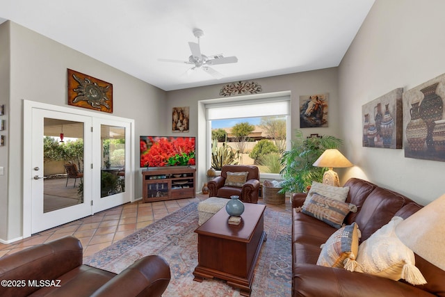 tiled living area with a ceiling fan and a healthy amount of sunlight