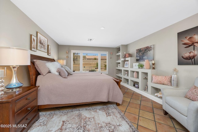 tiled bedroom featuring visible vents