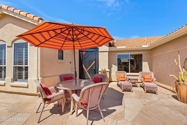 view of patio with outdoor dining area
