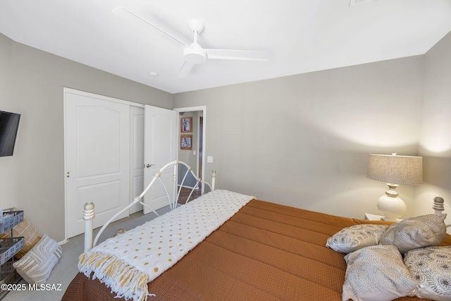 bedroom featuring a closet, a ceiling fan, and carpet floors