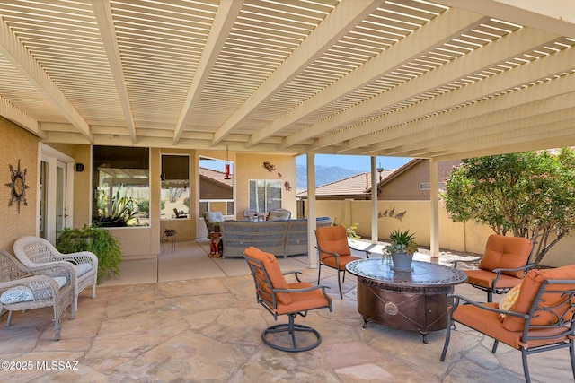 view of patio with a pergola, fence, and an outdoor hangout area