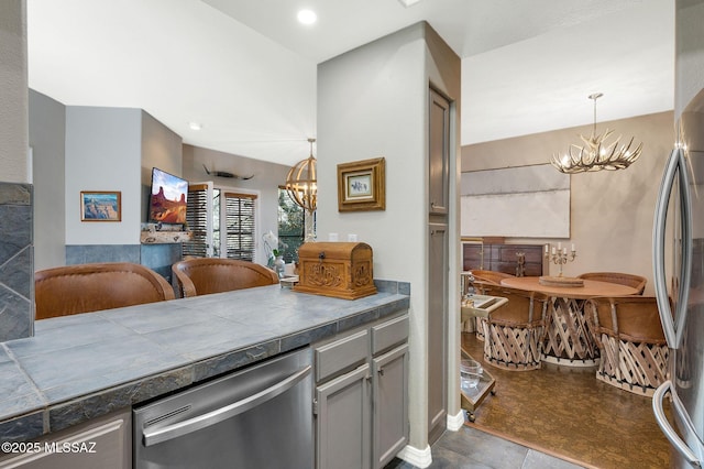 6655 N Canyon Crest Dr Unit 23102, Tucson, AZ 85750 - kitchen with a chandelier, appliances with stainless steel finishes, and dark countertops