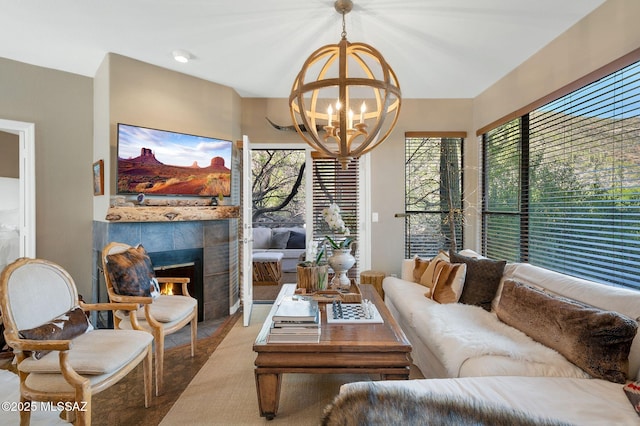 6655 N Canyon Crest Dr Unit 23102, Tucson, AZ 85750 - living room featuring a chandelier and a fireplace