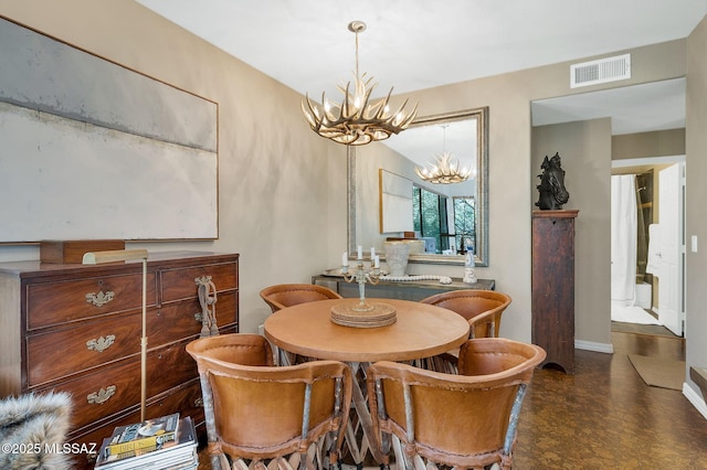 6655 N Canyon Crest Dr Unit 23102, Tucson, AZ 85750 - dining area with a chandelier and baseboards