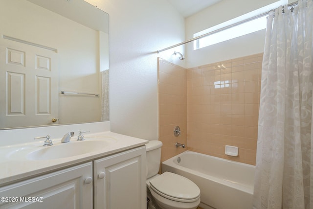full bath with toilet, vanity, and shower / bath combo with shower curtain