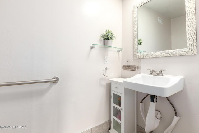 bathroom featuring a sink and visible vents