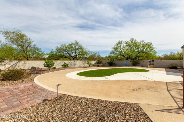view of yard with a fenced backyard and a patio
