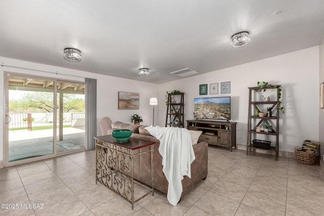 living area with light tile patterned floors and visible vents