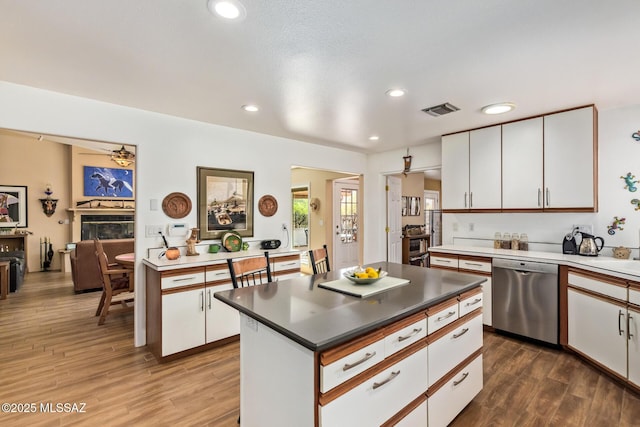 4720 E Wagon Train Rd, Tucson, AZ 85739 - kitchen featuring white cabinets, visible vents, dishwasher, recessed lighting, and dark wood-style floors