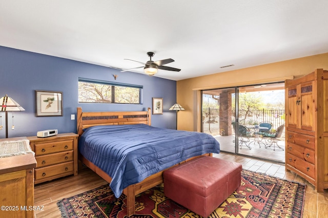 4720 E Wagon Train Rd, Tucson, AZ 85739 - bedroom with light wood-style flooring, access to exterior, visible vents, and multiple windows