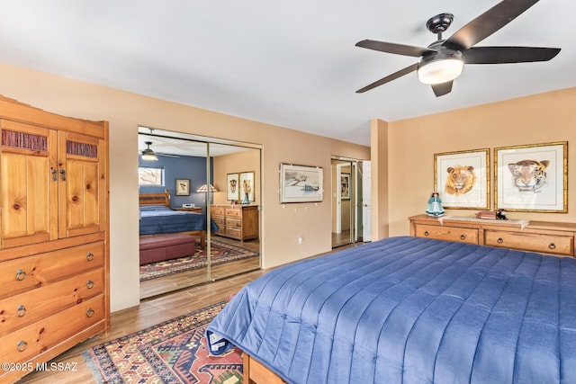 4720 E Wagon Train Rd, Tucson, AZ 85739 - bathroom with visible vents, a sink, double vanity, and wood finished floors