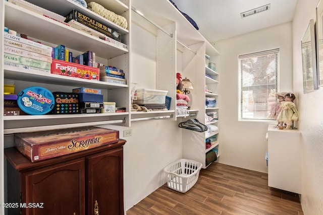 4720 E Wagon Train Rd, Tucson, AZ 85739 - walk in closet featuring dark wood-style flooring and visible vents