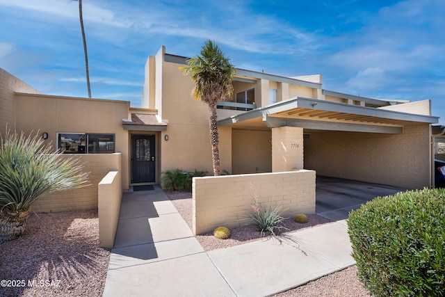 view of front of house featuring stucco siding
