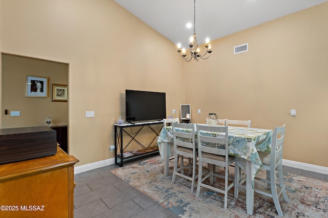 9704 E Paseo, San Rosendo, Tucson, AZ 85747 - tiled dining area featuring a notable chandelier, baseboards, visible vents, and lofted ceiling