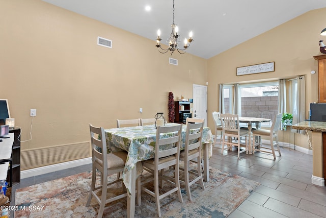9704 E Paseo, San Rosendo, Tucson, AZ 85747 - dining space featuring visible vents, baseboards, high vaulted ceiling, and a chandelier
