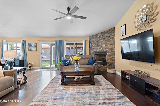 9704 E Paseo, San Rosendo, Tucson, AZ 85747 - living room with dark wood-style flooring, a stone fireplace, baseboards, and ceiling fan