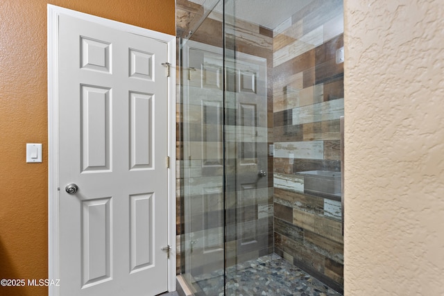 9704 E Paseo, San Rosendo, Tucson, AZ 85747 - bathroom with a shower stall and a textured wall