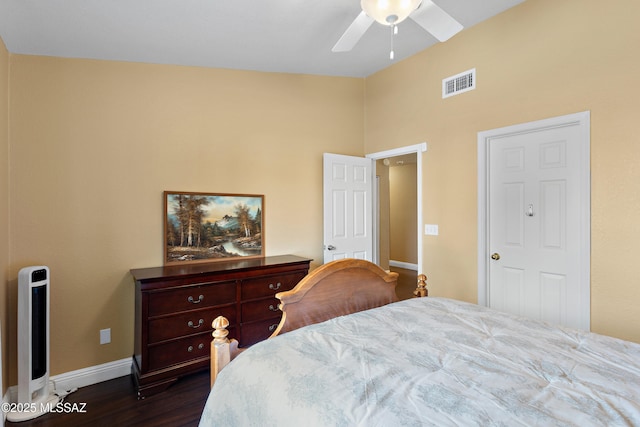 9704 E Paseo, San Rosendo, Tucson, AZ 85747 - bedroom with dark wood-type flooring, visible vents, baseboards, and ceiling fan