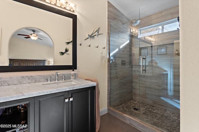 9704 E Paseo, San Rosendo, Tucson, AZ 85747 - full bathroom featuring vanity, a ceiling fan, vaulted ceiling, a stall shower, and tile patterned floors