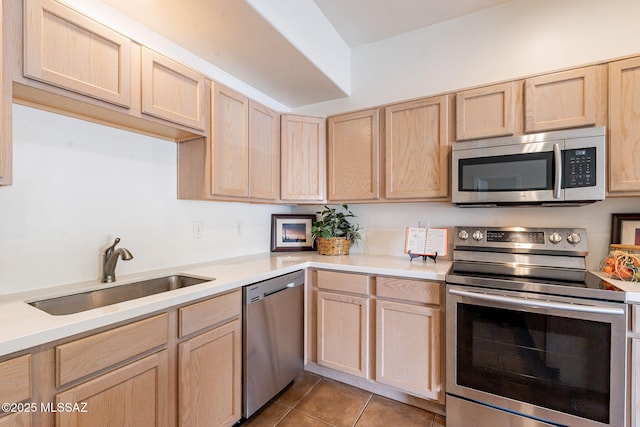 4173 N Fortune Loop, Tucson, AZ 85719 - kitchen with appliances with stainless steel finishes, a sink, light brown cabinetry, and light countertops