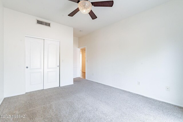 4173 N Fortune Loop, Tucson, AZ 85719 - unfurnished bedroom with carpet flooring, a closet, baseboards, and a ceiling fan