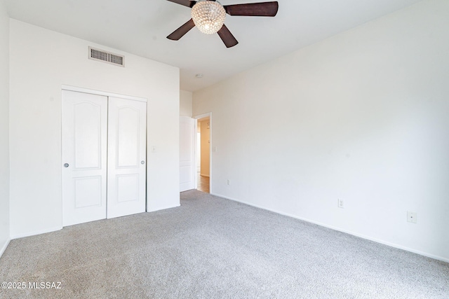 4173 N Fortune Loop, Tucson, AZ 85719 - unfurnished bedroom featuring carpet flooring, a closet, baseboards, and a ceiling fan