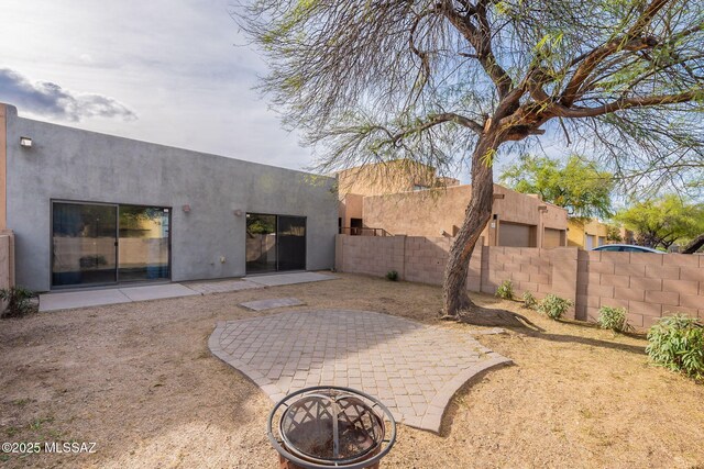 4173 N Fortune Loop, Tucson, AZ 85719 - rear view of property with stucco siding and a patio area