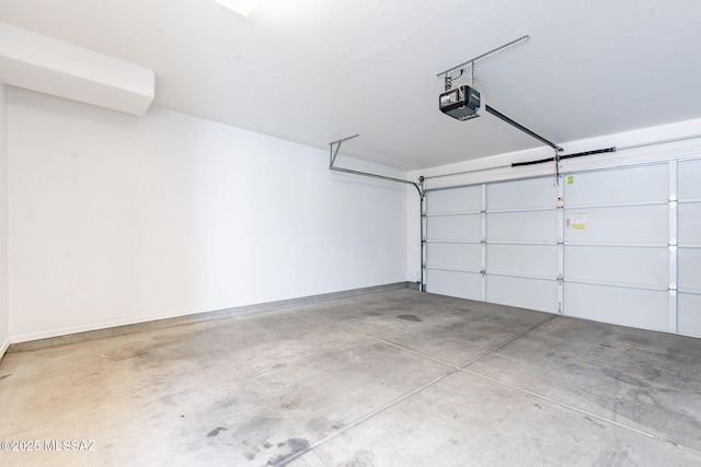 4173 N Fortune Loop, Tucson, AZ 85719 - garage featuring a garage door opener and baseboards
