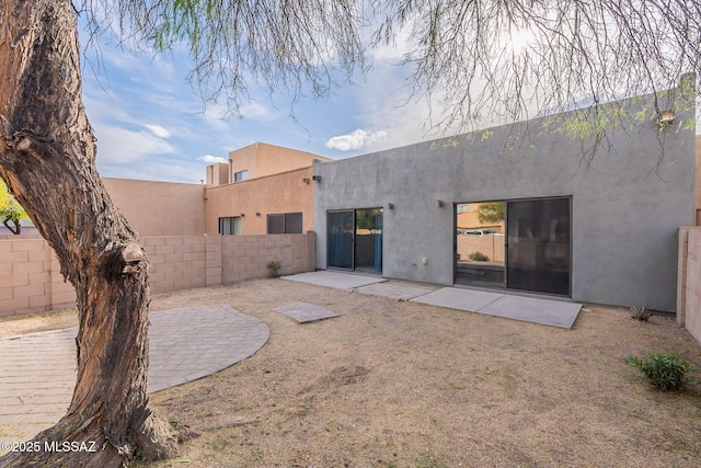 4173 N Fortune Loop, Tucson, AZ 85719 - back of house with a fenced backyard, stucco siding, and a patio area