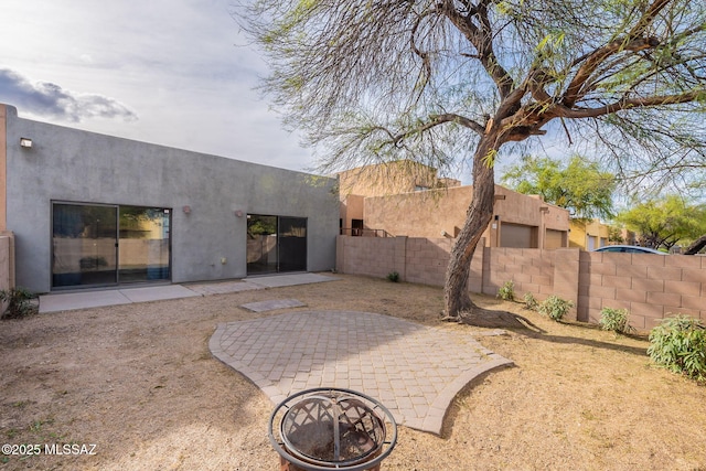 4173 N Fortune Loop, Tucson, AZ 85719 - rear view of property featuring stucco siding and a patio