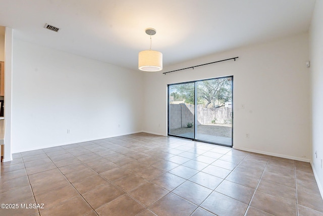 4173 N Fortune Loop, Tucson, AZ 85719 - spare room featuring tile patterned floors and baseboards
