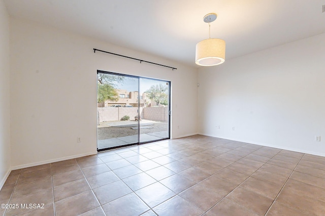4173 N Fortune Loop, Tucson, AZ 85719 - tiled empty room with baseboards