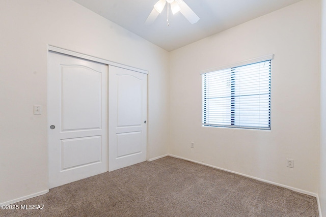4173 N Fortune Loop, Tucson, AZ 85719 - unfurnished bedroom featuring carpet floors, a closet, baseboards, and ceiling fan