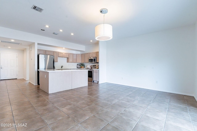 4173 N Fortune Loop, Tucson, AZ 85719 - kitchen with appliances with stainless steel finishes, light countertops, recessed lighting, a kitchen island, and light tile patterned floors