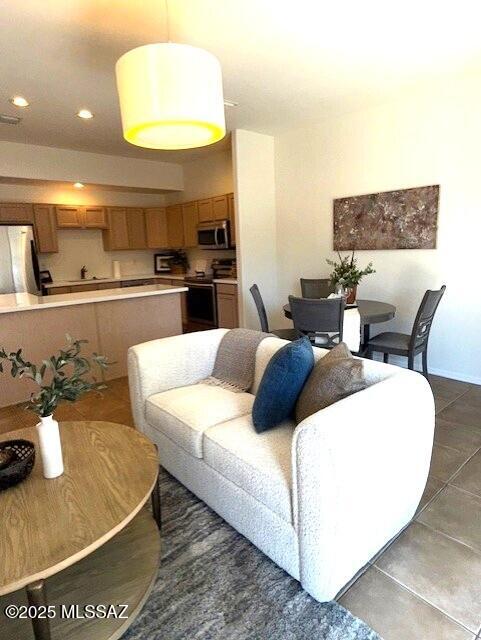 4173 N Fortune Loop, Tucson, AZ 85719 - living area with dark tile patterned floors and recessed lighting