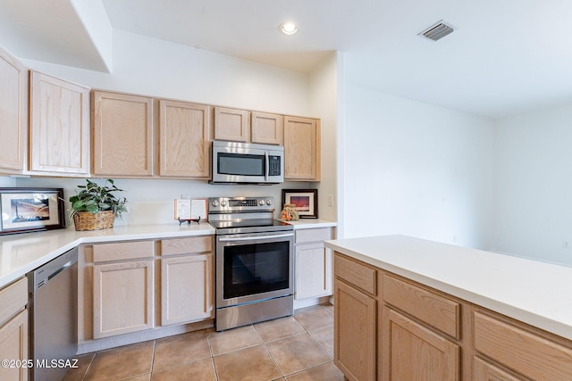4173 N Fortune Loop, Tucson, AZ 85719 - kitchen with stainless steel appliances, light brown cabinets, light tile patterned floors, light countertops, and recessed lighting