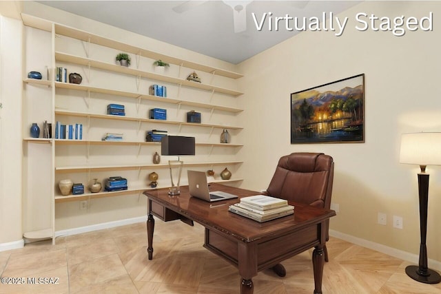 office featuring baseboards and ceiling fan