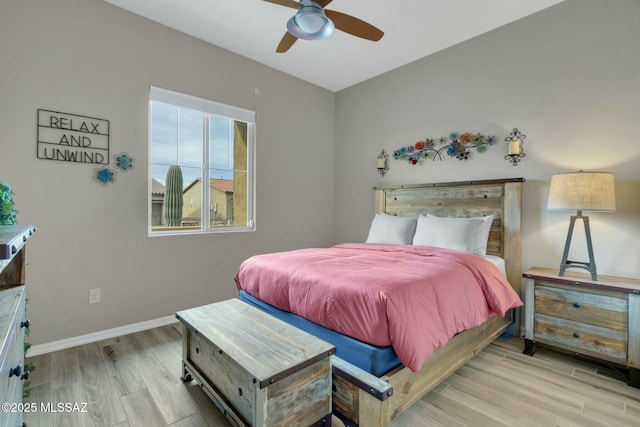 bedroom featuring baseboards, ceiling fan, and wood finished floors