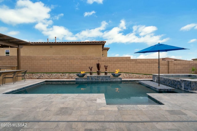 view of swimming pool with a fenced in pool, a patio, an in ground hot tub, and a fenced backyard