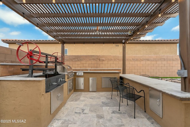 view of patio featuring exterior bar, a pergola, area for grilling, and a grill