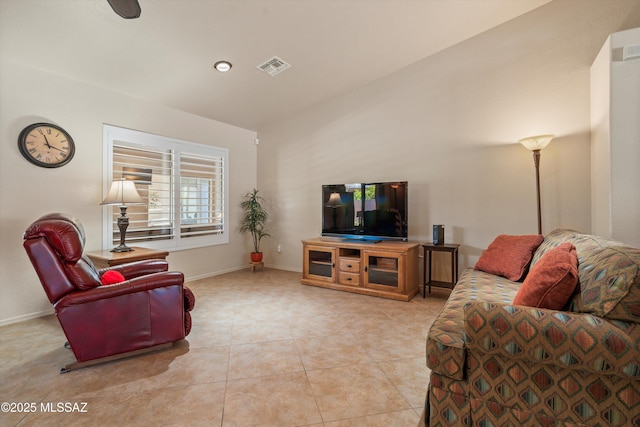 living area with light tile patterned flooring, baseboards, and visible vents