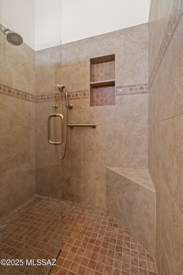 bathroom featuring a shower stall